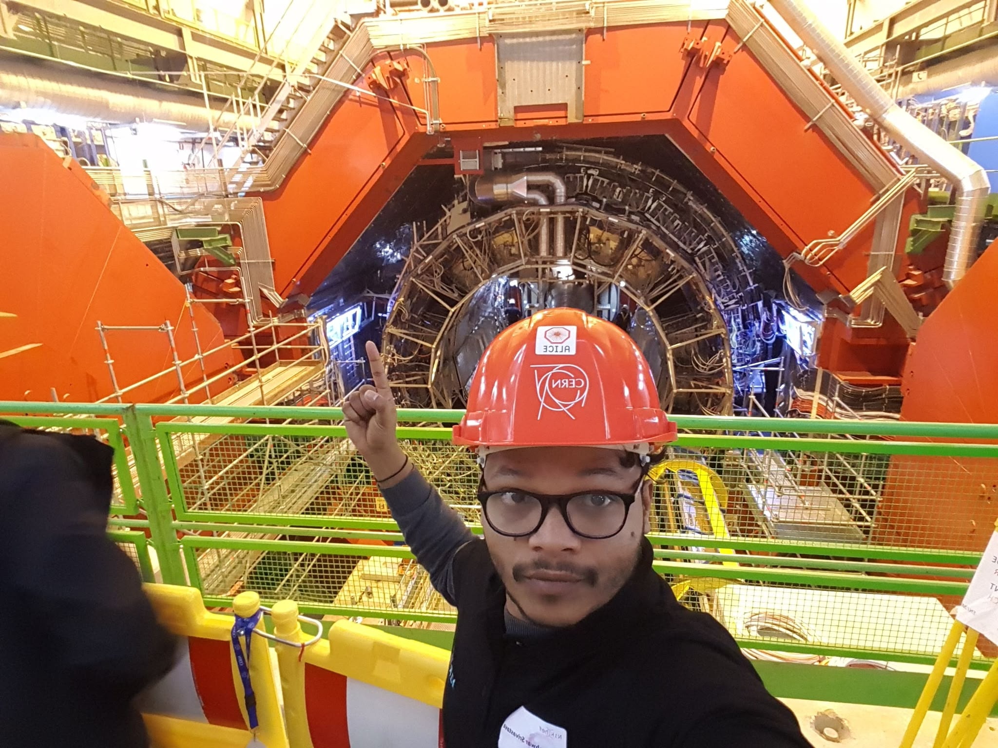 Mangal Srivastava standing inside the CMS detector at CERN, Geneva